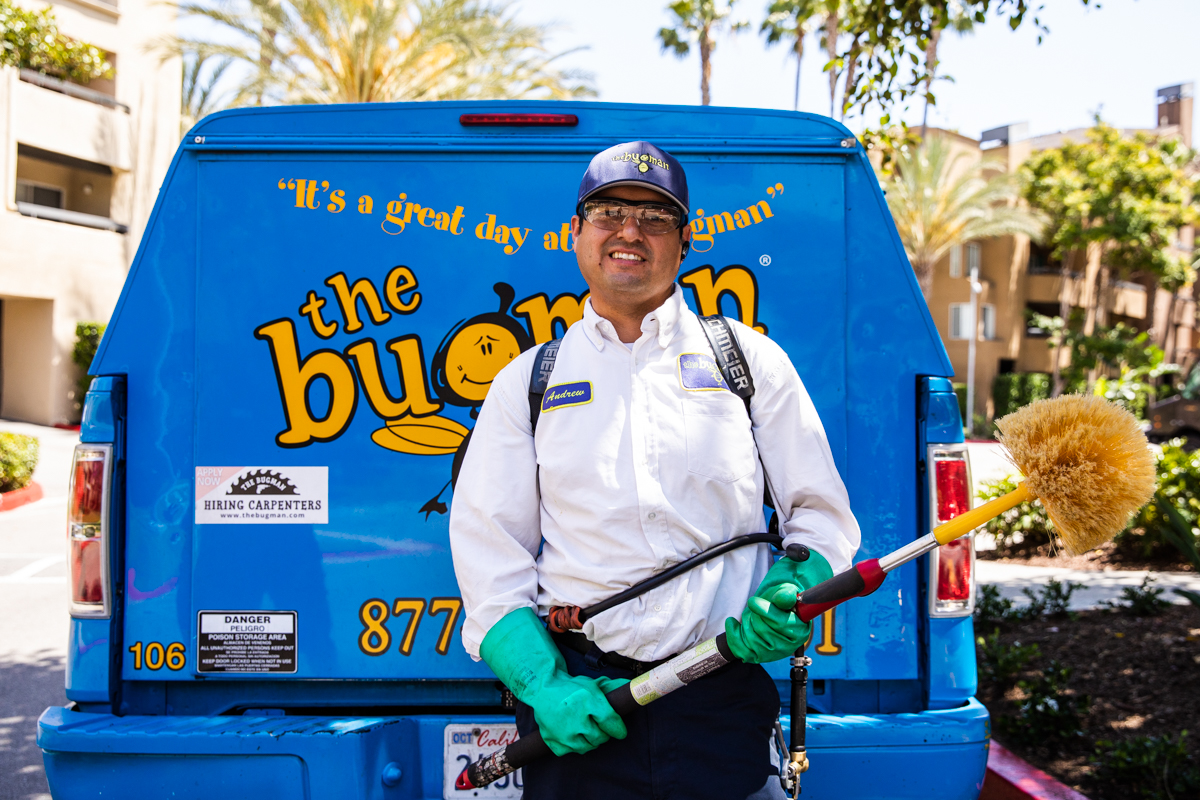 the bugman exterminator in front of a truck