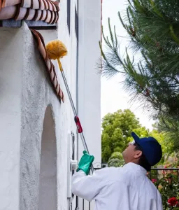 exterminator applying pest control treatment